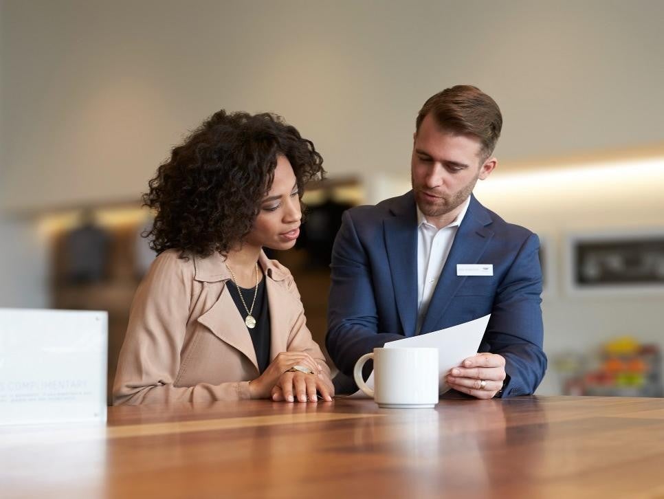 woman with salesman calculating Bomnin Buick GMC Nanuet in Nanuet NY