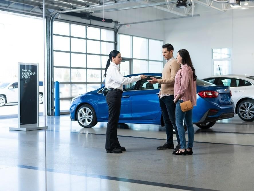 salesperson and customers at Bomnin Buick GMC Nanuet in Nanuet NY